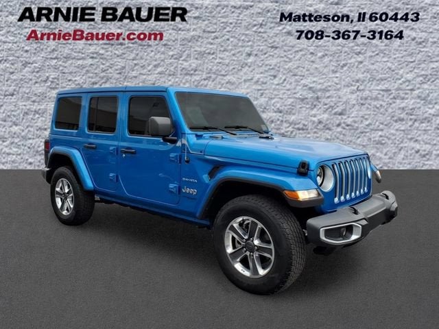 2022 Jeep Wrangler Unlimited Sahara in Hydro Blue Pearl Coat — front three-quarter view