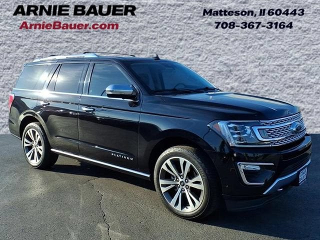 2021 Ford Expedition Platinum in Agate Black Metallic — front three-quarter view