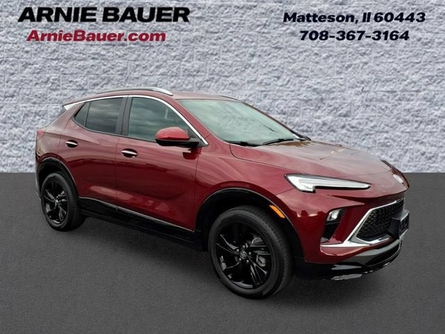 2024 Buick Encore GX Sport Touring in Cinnabar Metallic — front three-quarter view